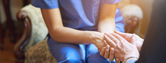 Nurse holding hand