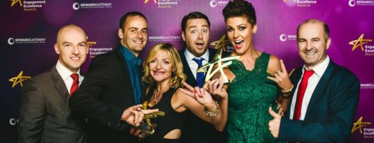 People celebrating an award