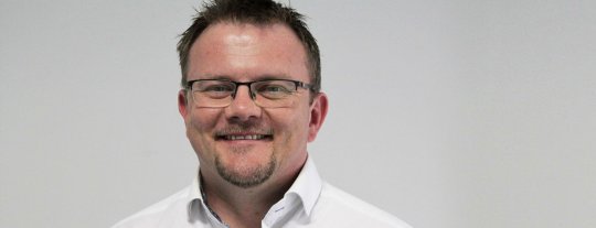 Man wearing glasses smiling