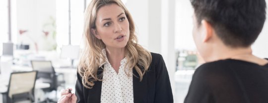 Lady dressed formally explaining the dismissal procedure