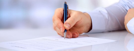 Someone filling in a form